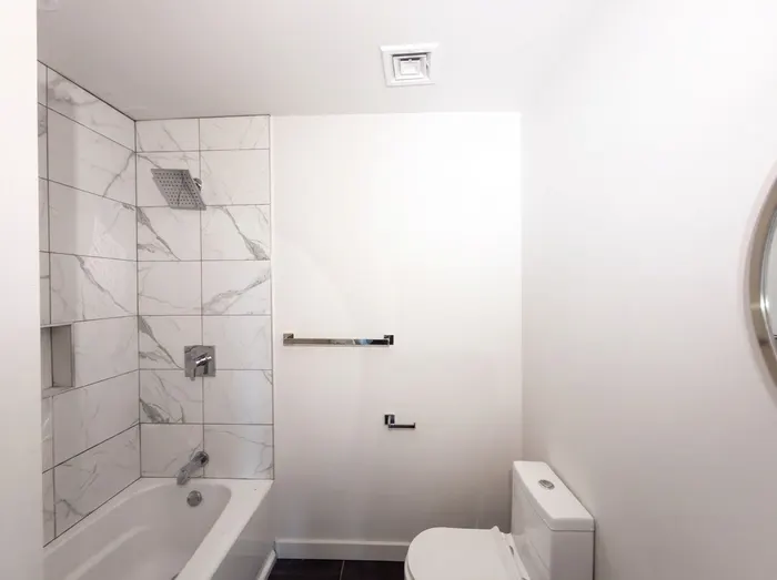 Updated bathroom with marble-style finish