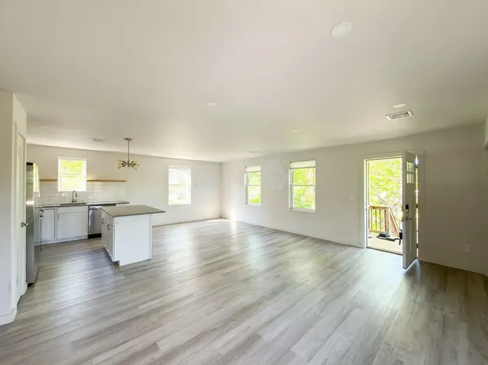 Second wide living and kitchen view