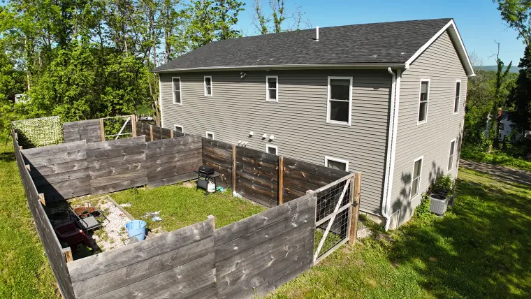 Aerial view of the side yard and building exterior at 23-25 Highland Avenue