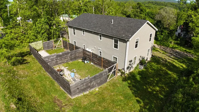 Aerial view of the Highland Avenue property and neighboring homes