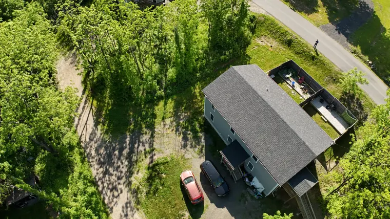 Drone photo looking over the property and surrounding neighborhood