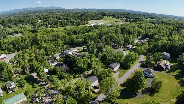 Aerial image showing the property approach and local surroundings